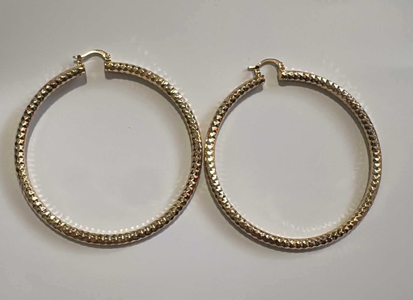 GOLD TWIRLED HOOPS